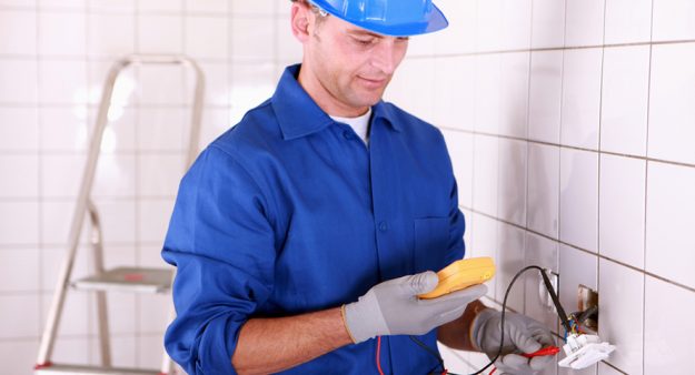 Do You Need an Energy Audit An electrician doing some checks