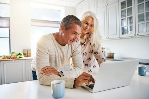 elderly-retired-couple-reading-their-social-media-PWCVTD8 elderly-retired-couple-reading-their-social-media-PWCVTD8