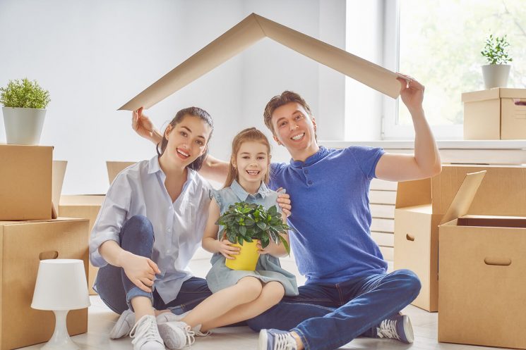 is solar power right for my home A family holding a cardboard