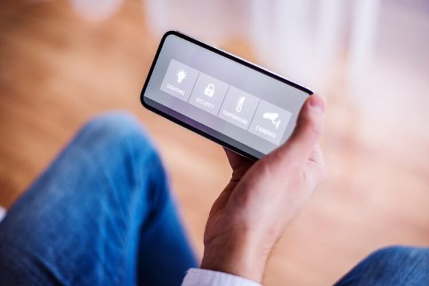 a-smarthphone-with-smart-home-screen-PX9JHKF man holding a smartphone