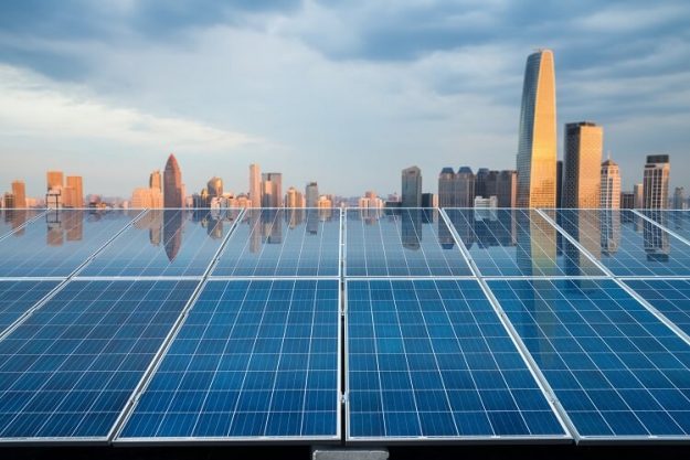 solar-energy-panel-with-city-twilight-PZD63YF solar energy panel in the city